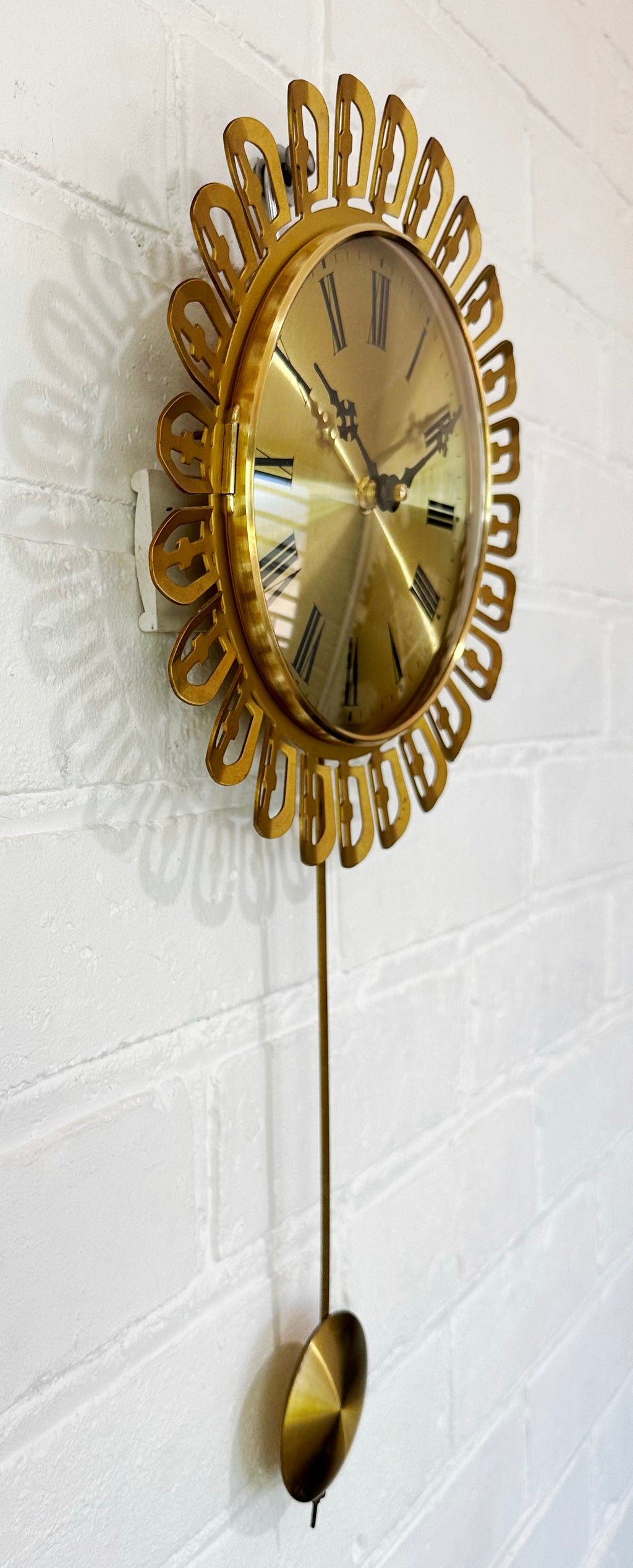 Vintage German Starburst Metal Pendulum Battery Wall Clock | eXibit collection