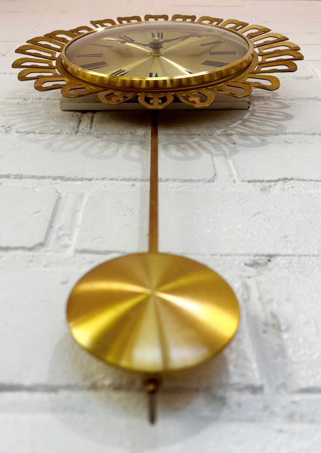 Vintage German Starburst Metal Pendulum Battery Wall Clock | eXibit collection