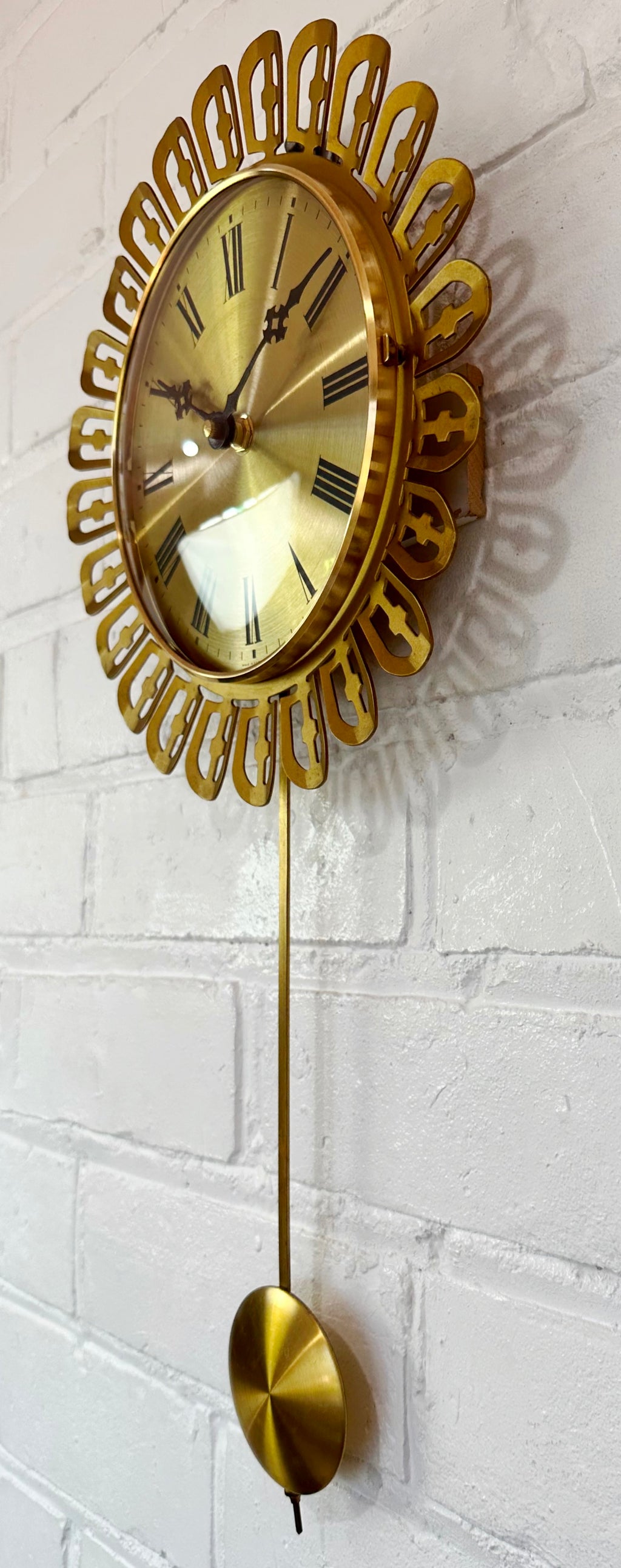 Vintage German Starburst Metal Pendulum Battery Wall Clock | eXibit collection