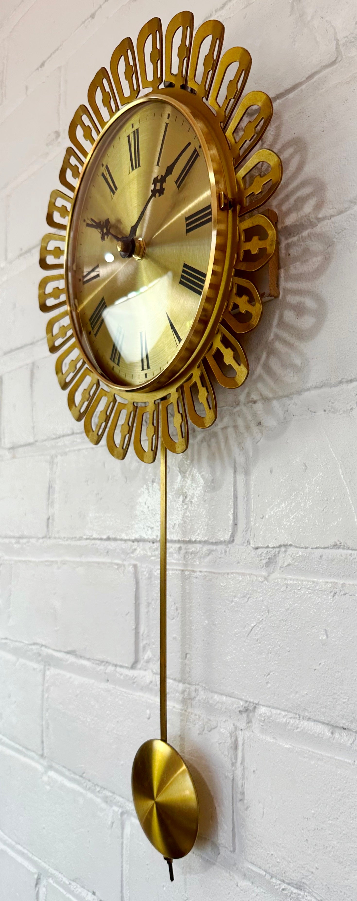 Vintage German Starburst Metal Pendulum Battery Wall Clock | eXibit collection