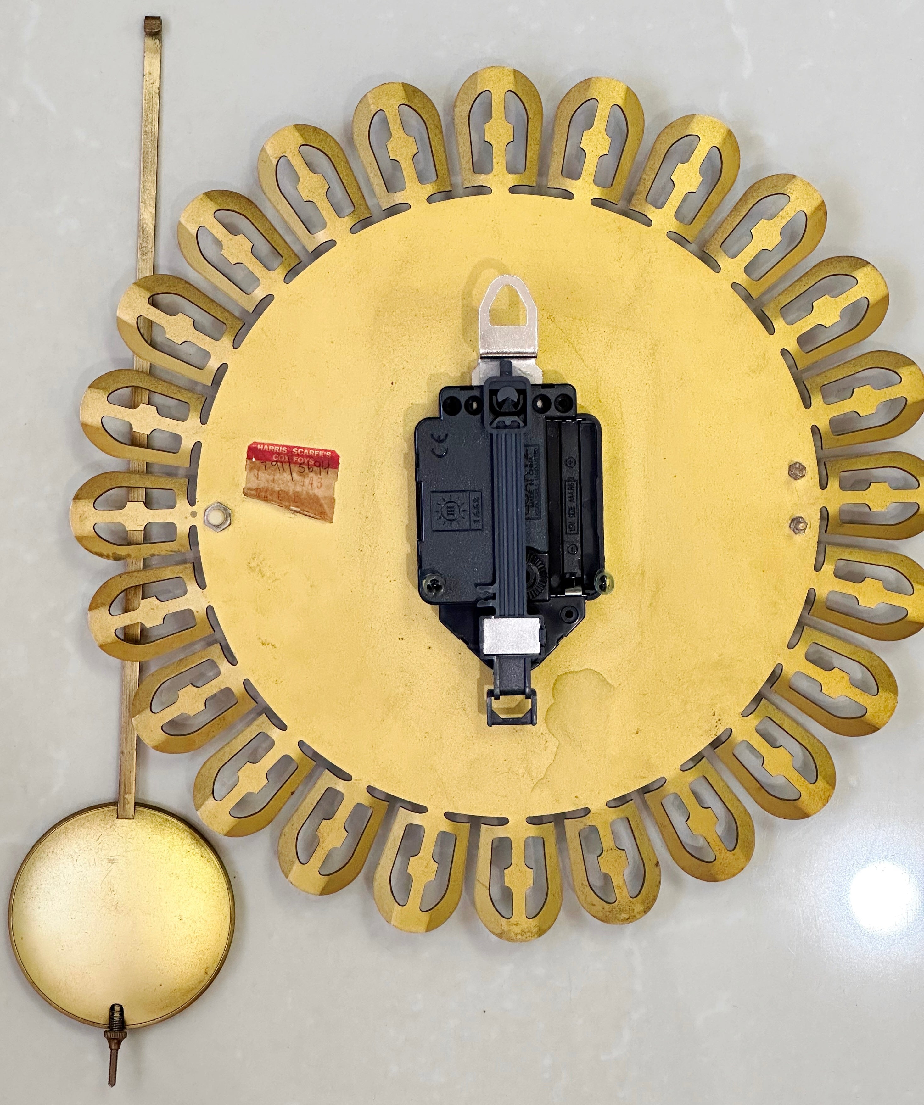 Vintage German Starburst Metal Pendulum Battery Wall Clock | eXibit collection